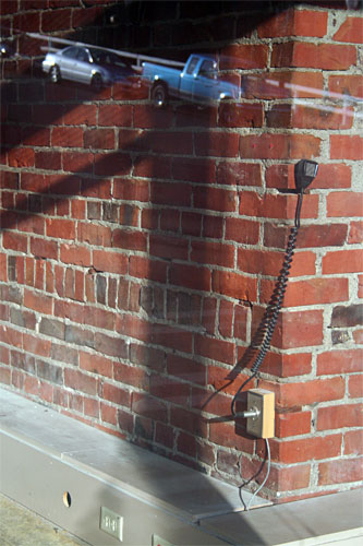 Room with brick and CB announcement mic